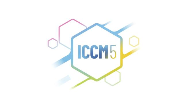 A rainbow colored molecular graphic sits behind rainbow text that reads: ICCM5
